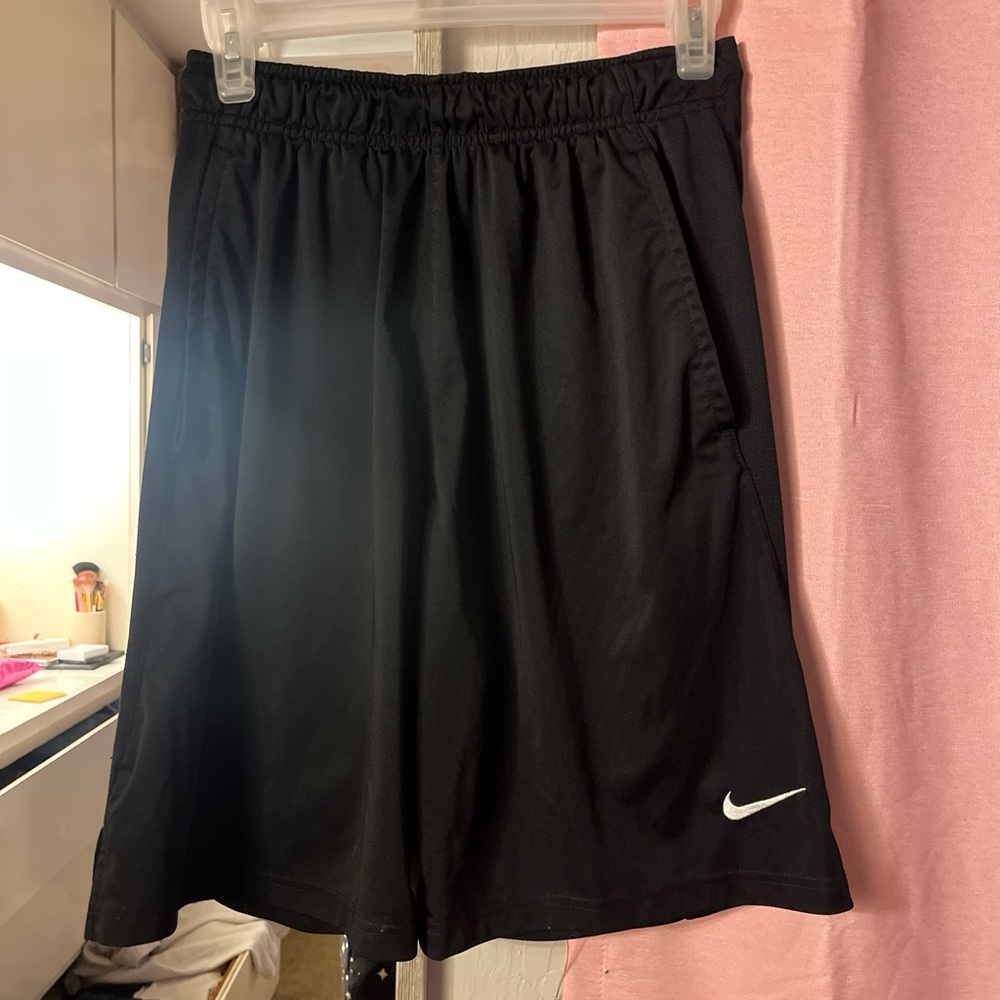 Black and white Nike basketball shorts. Size small.